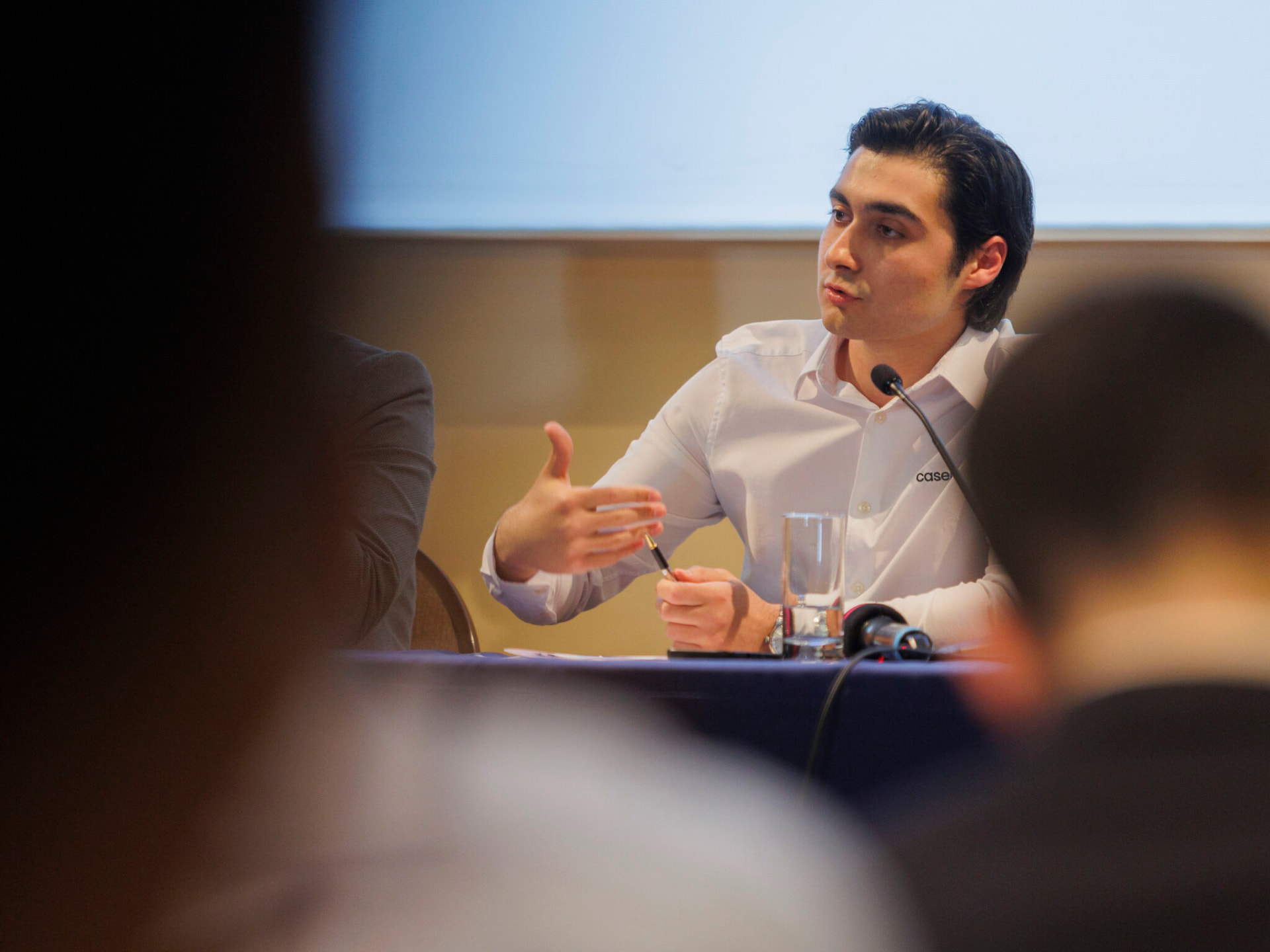 Speaking on applied legal AI, wearing the casepal shirt